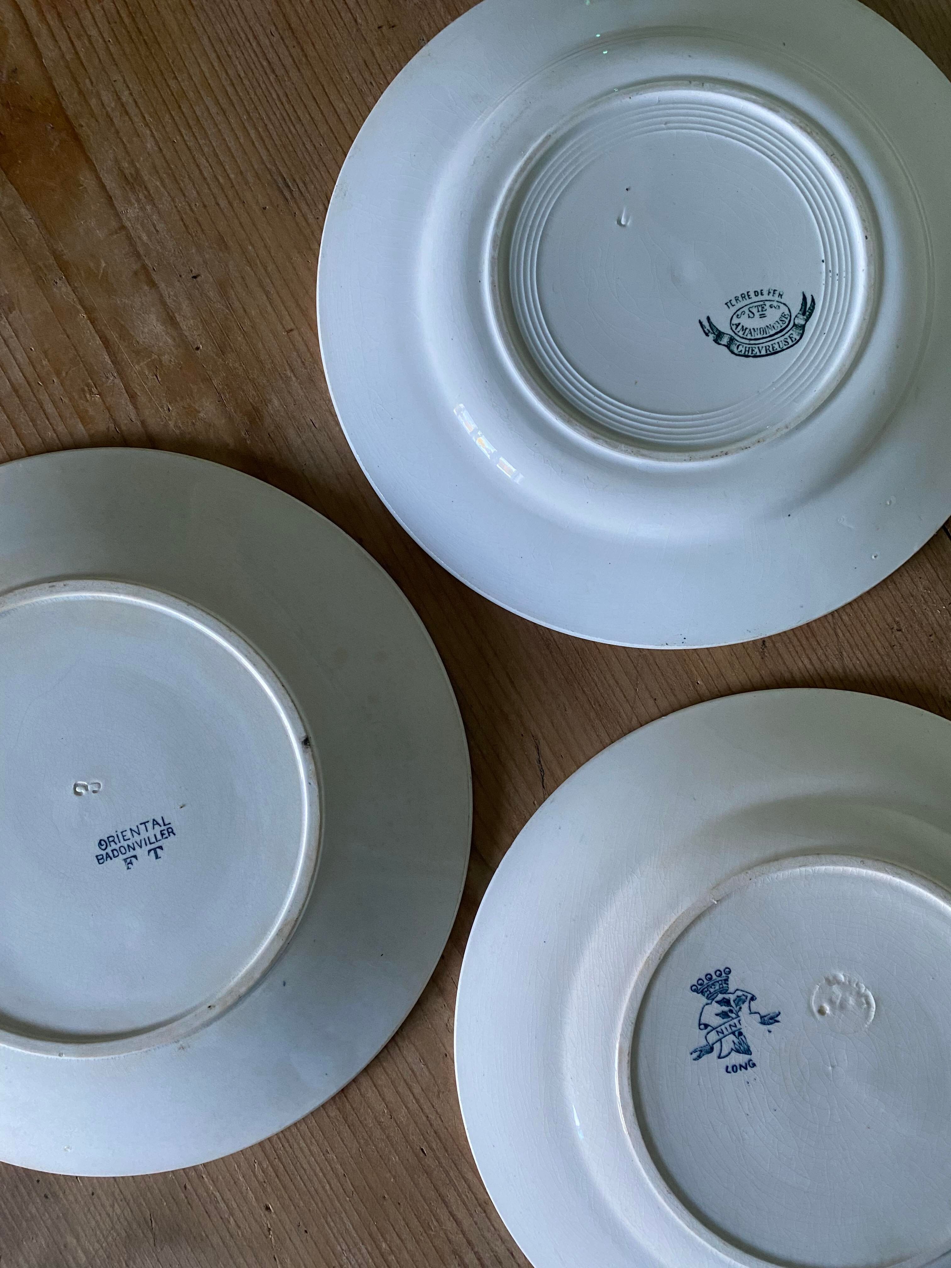 Set of 6 old flat plates in mismatched iron earth