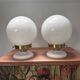 Pair of wall sconces with white opaline globes