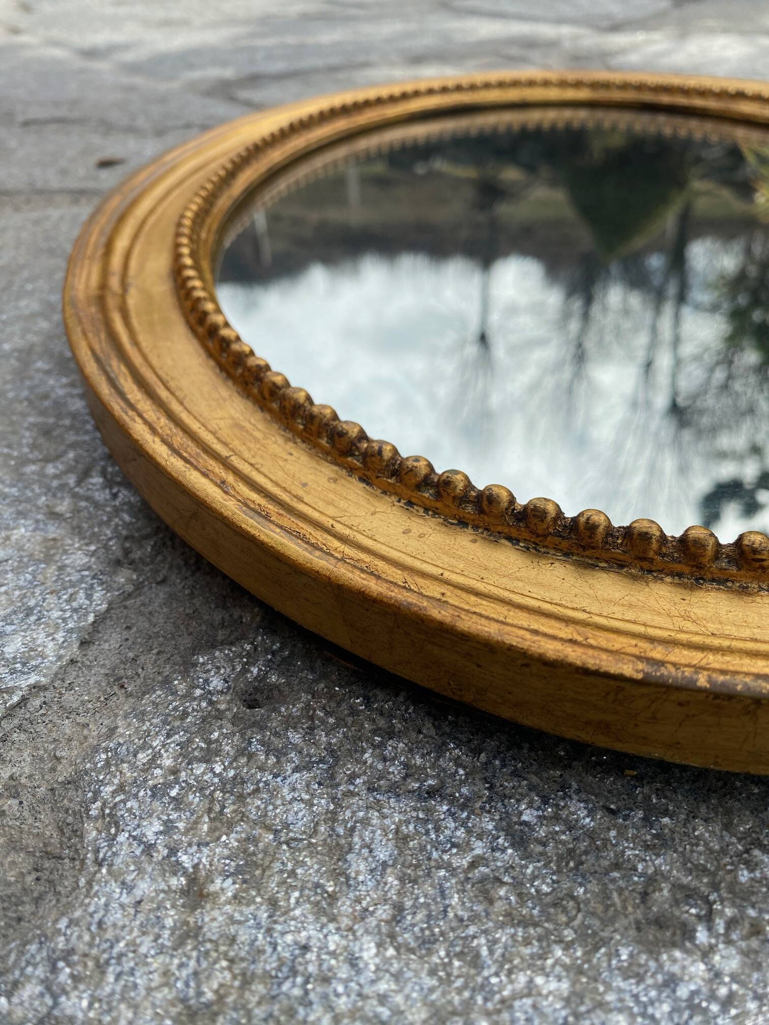 Antique gold oval mirror