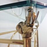 Hollywood Regency brass and glass shelf with elephant heads from the 1970s
