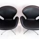 A pair of Swan chairs, model 3320, designed by Arne Jacobsen in 1958