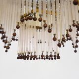 Art Nouveau style bronze chandelier with yellow and mauve pendants, 11 lights. 1960s