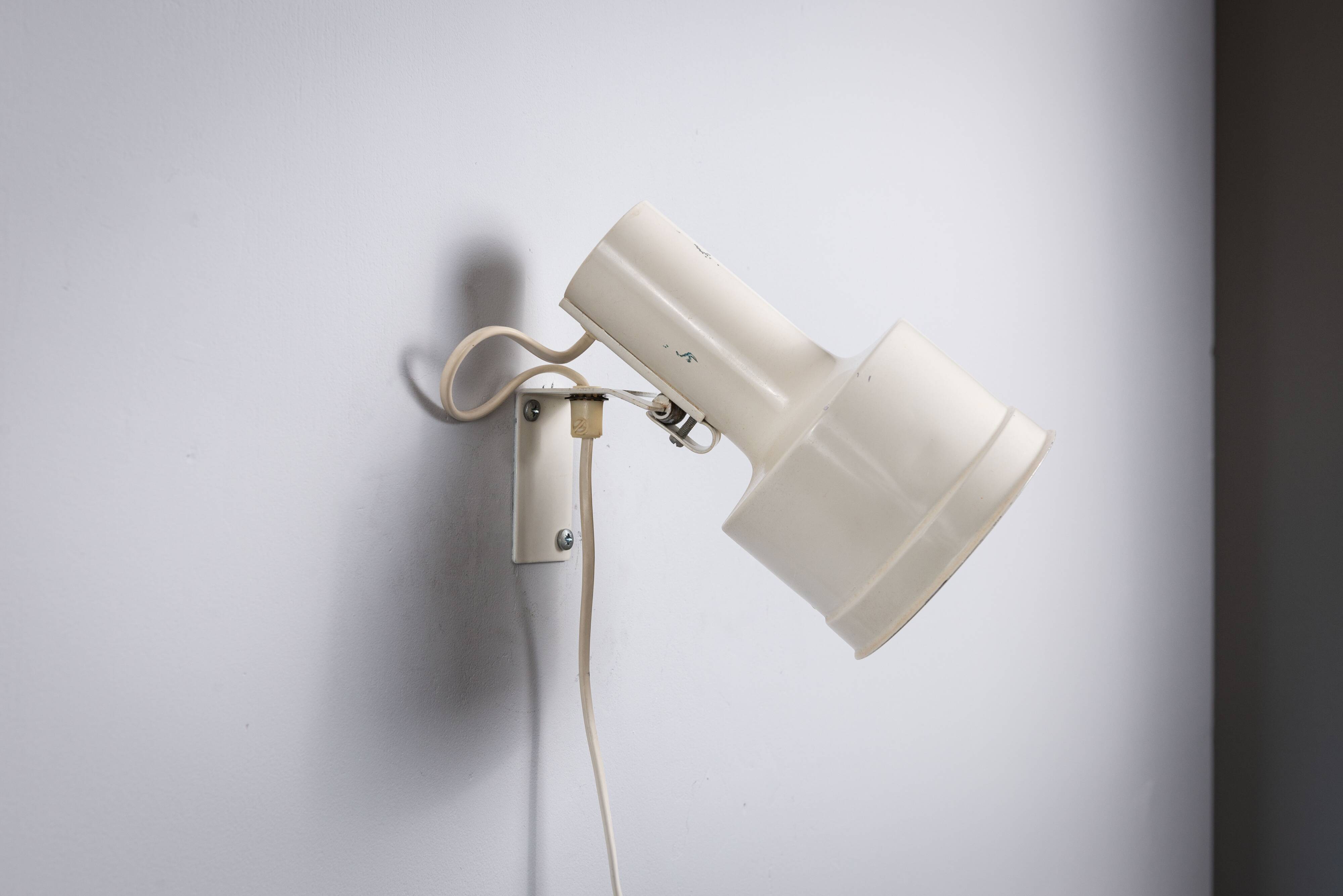 Pair of adjustable wall lamps designed by Per Sundstedt for Kosta Lampan