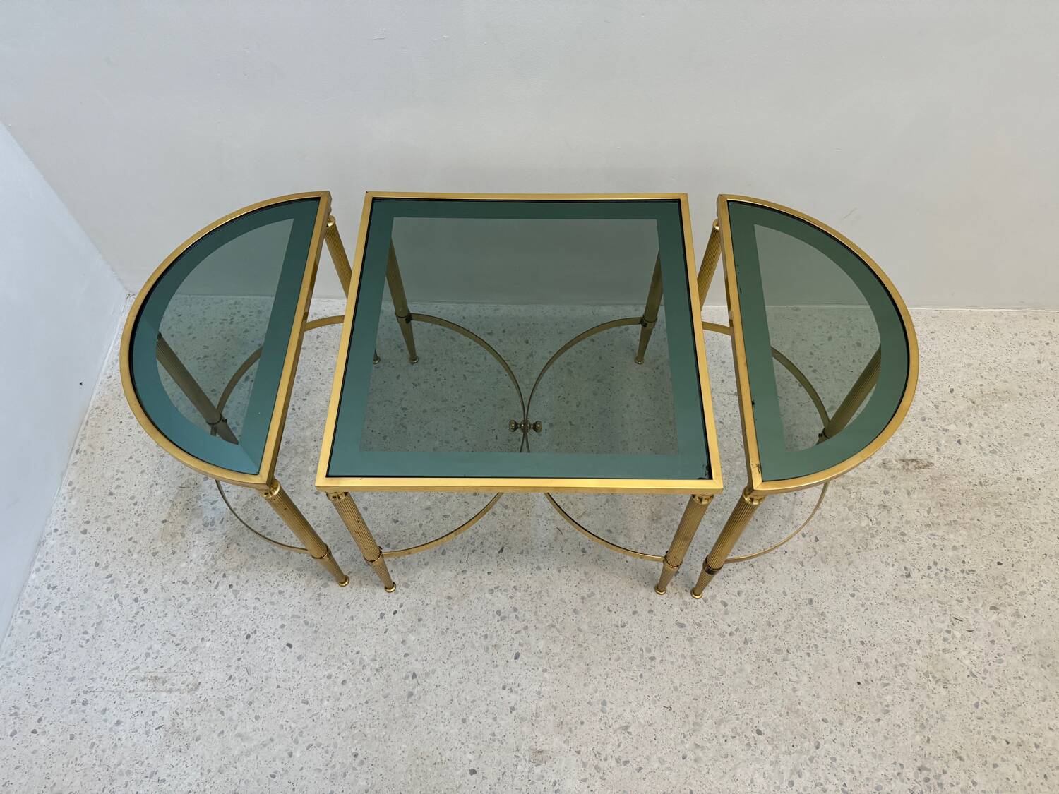 Neo classic coffee table in brass and smoked glass
