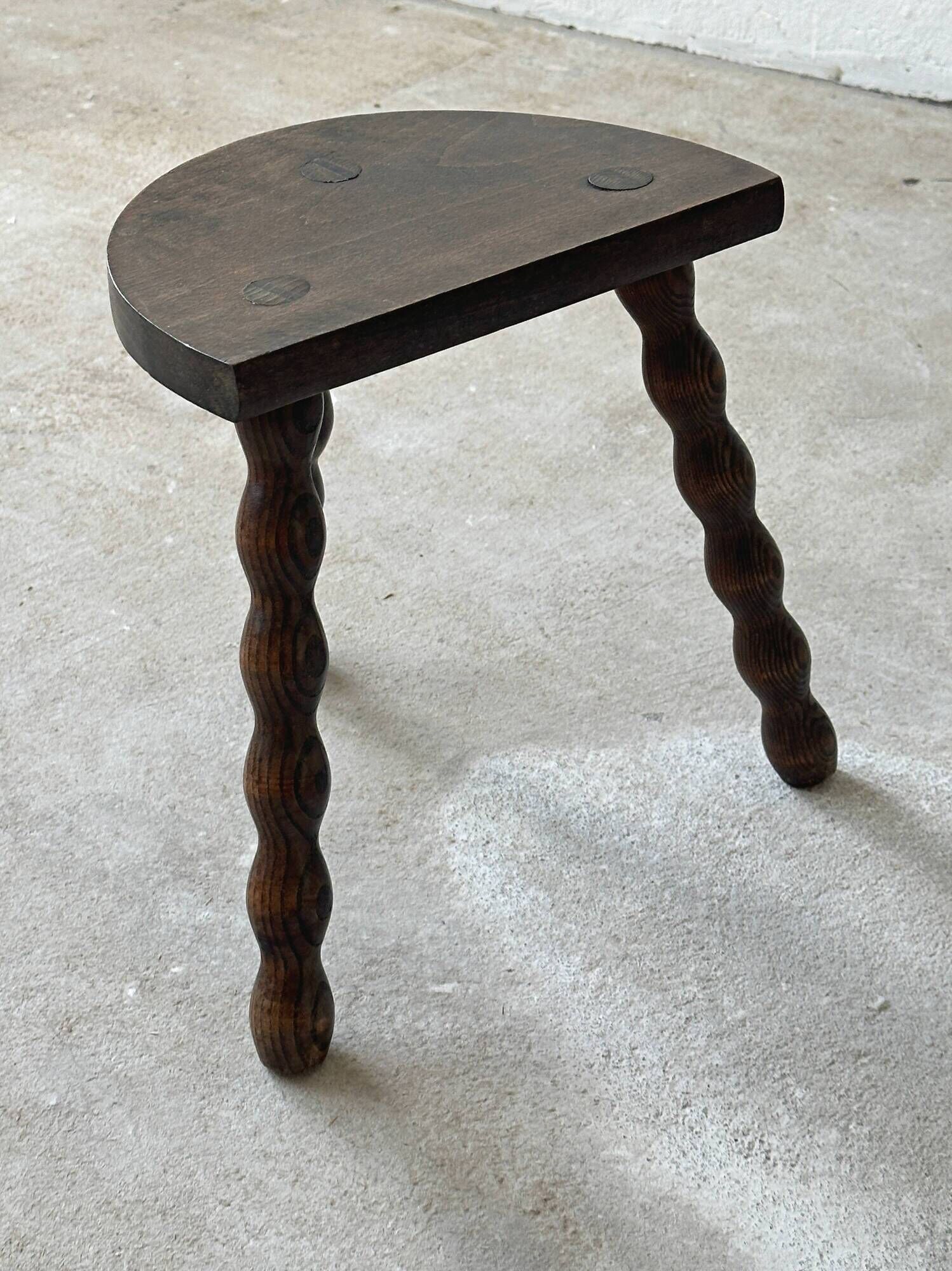 Two French farmhouse stools made of turned wood.