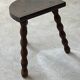 Two French farmhouse stools made of turned wood.