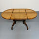Vintage dining table with a cane top by Mundus from the 1970s.