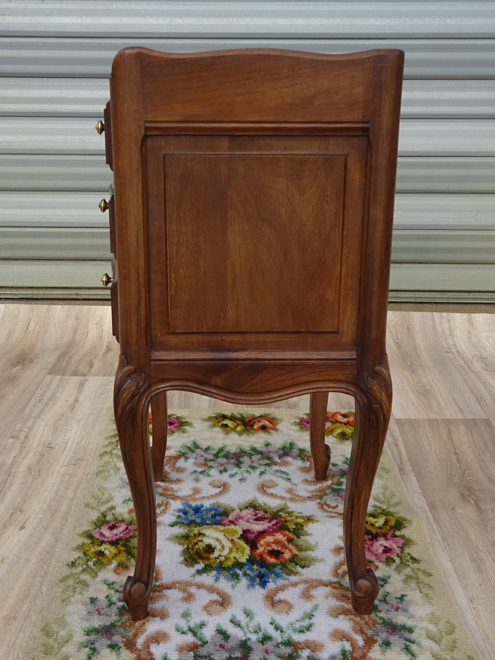 Louis XV bedside table in walnut, 3 drawers, raised edges on the tops.