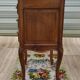 Louis XV bedside table in walnut, 3 drawers, raised edges on the tops.