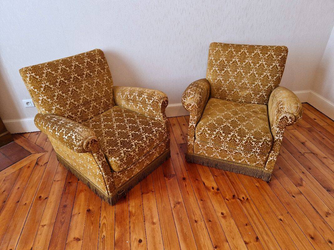 Pair of golden fringed armchairs