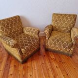 Pair of golden fringed armchairs
