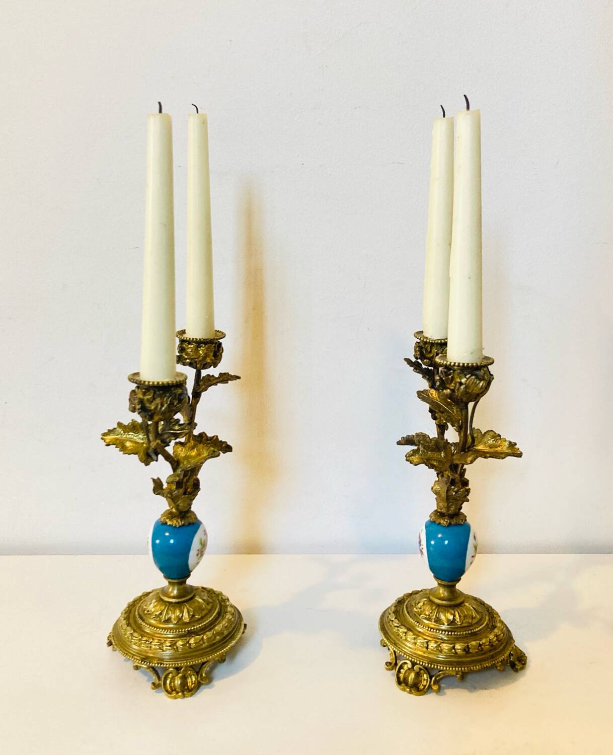 19th century candle holders in gilded bronze and porcelain