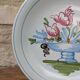 Plate with hand-painted flower bouquet on light blue background 25cm