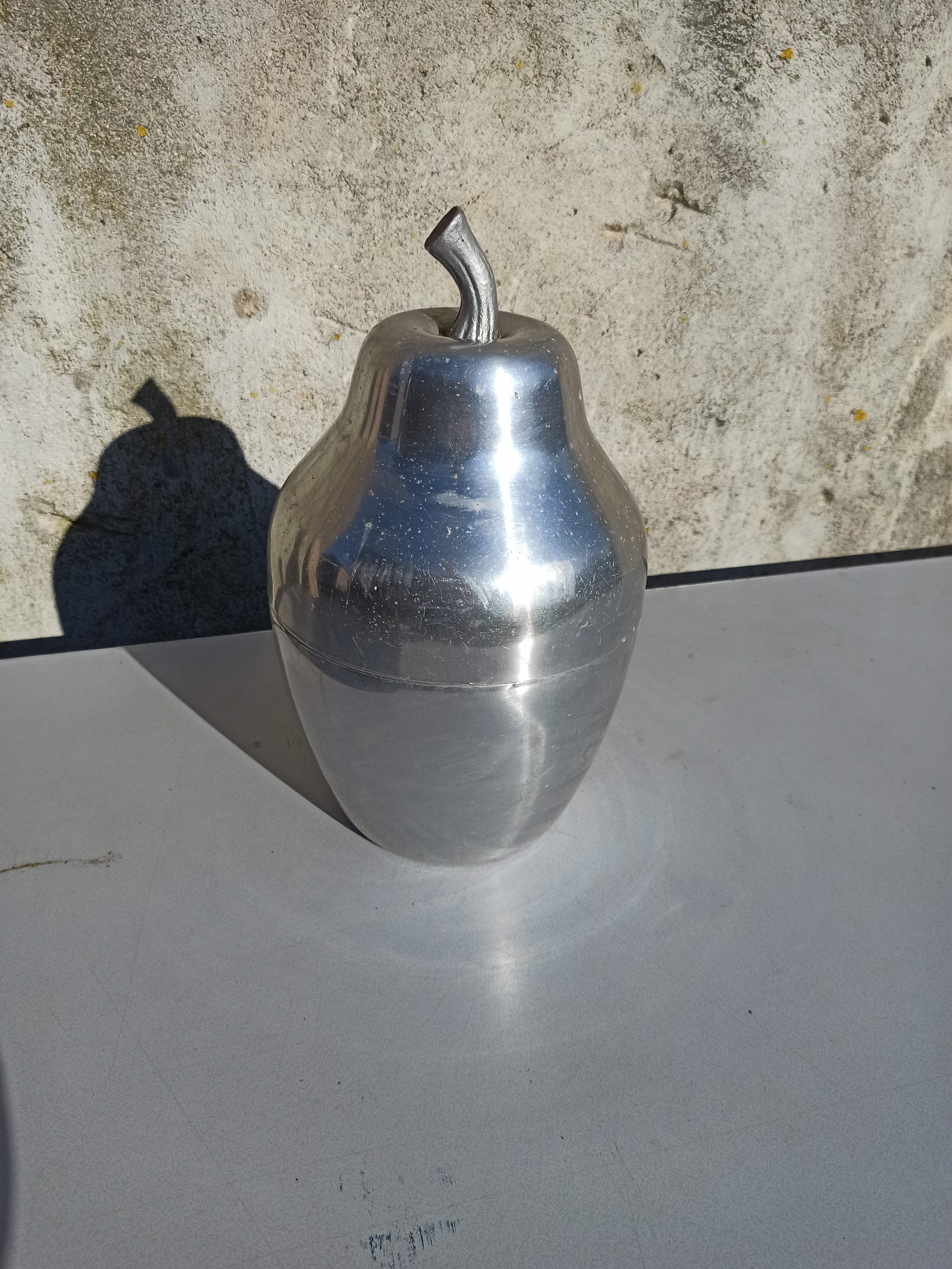 Old ice bucket ice cube in the shape of aluminum pear