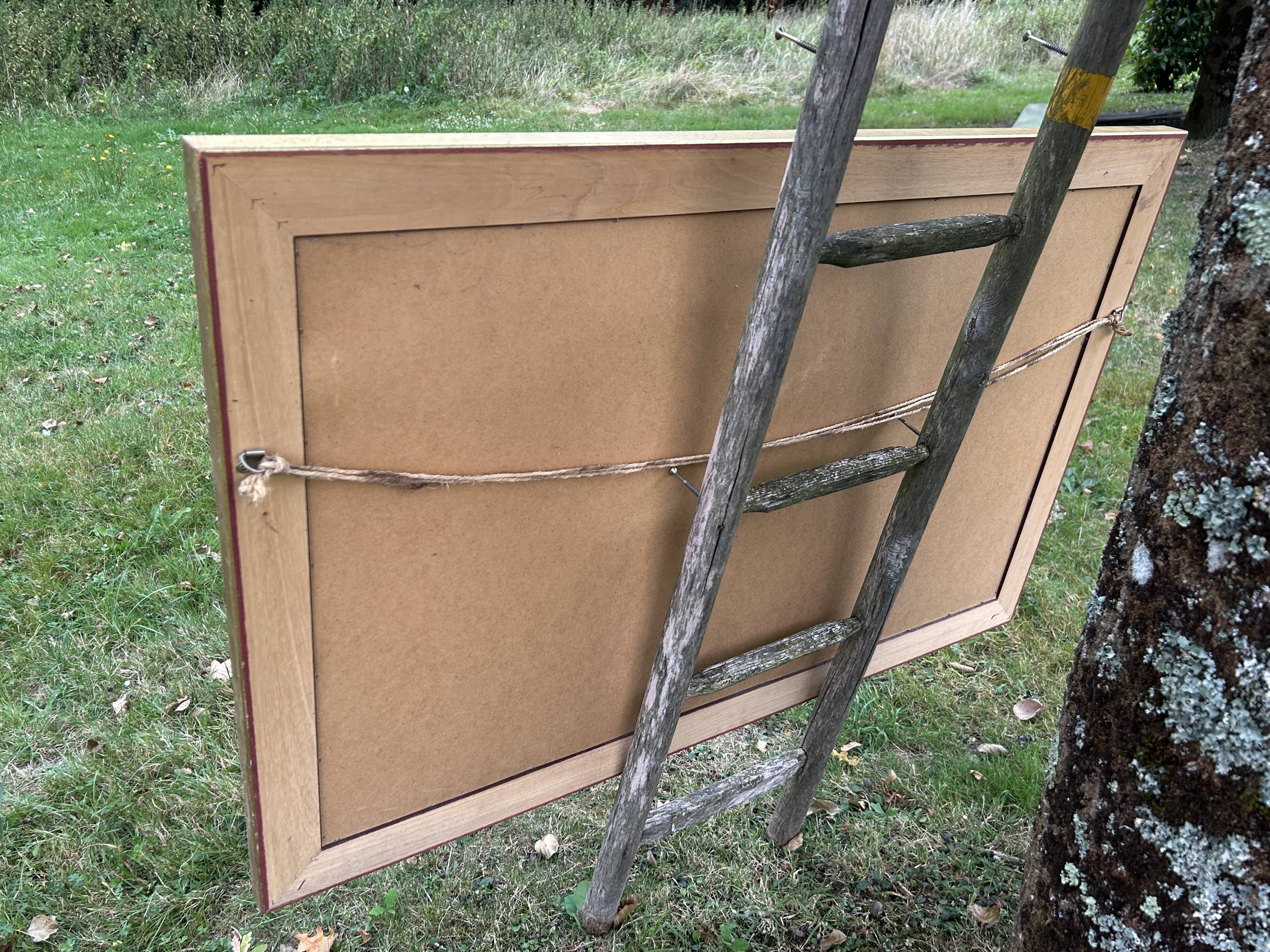 Large beveled mirror in wood and gilded stucco