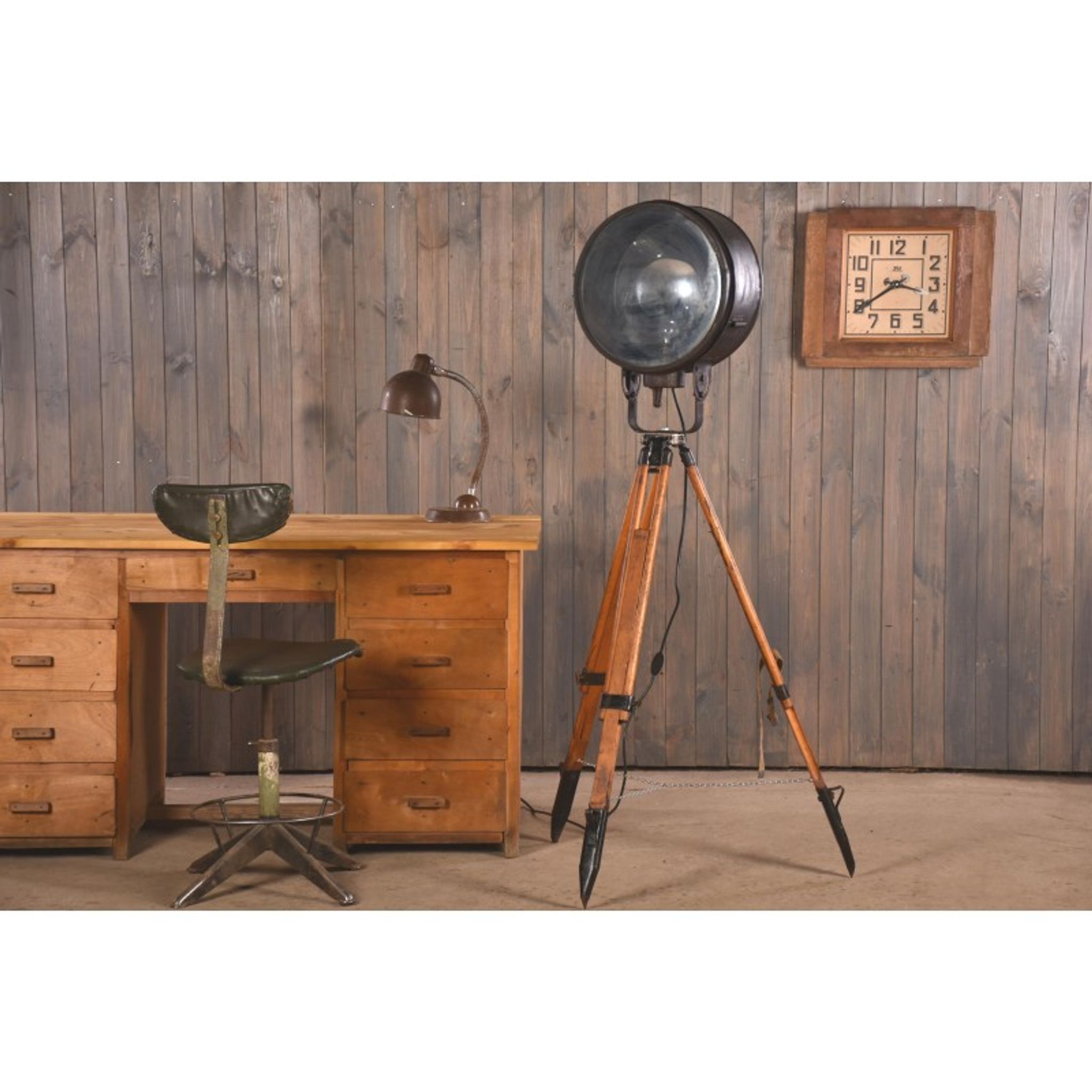 Old industrial spot on wooden tripod