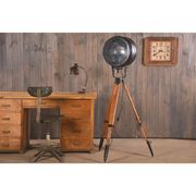 Old industrial spot on wooden tripod