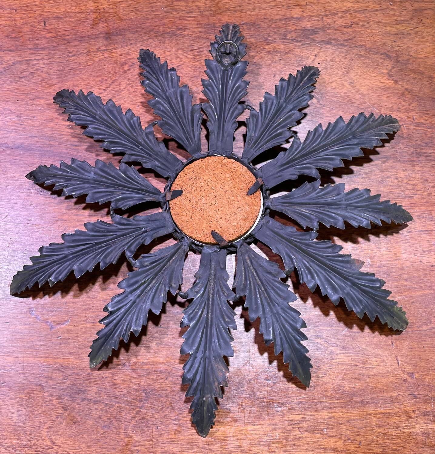 Metal mirror with foliage decoration