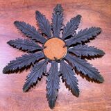 Metal mirror with foliage decoration
