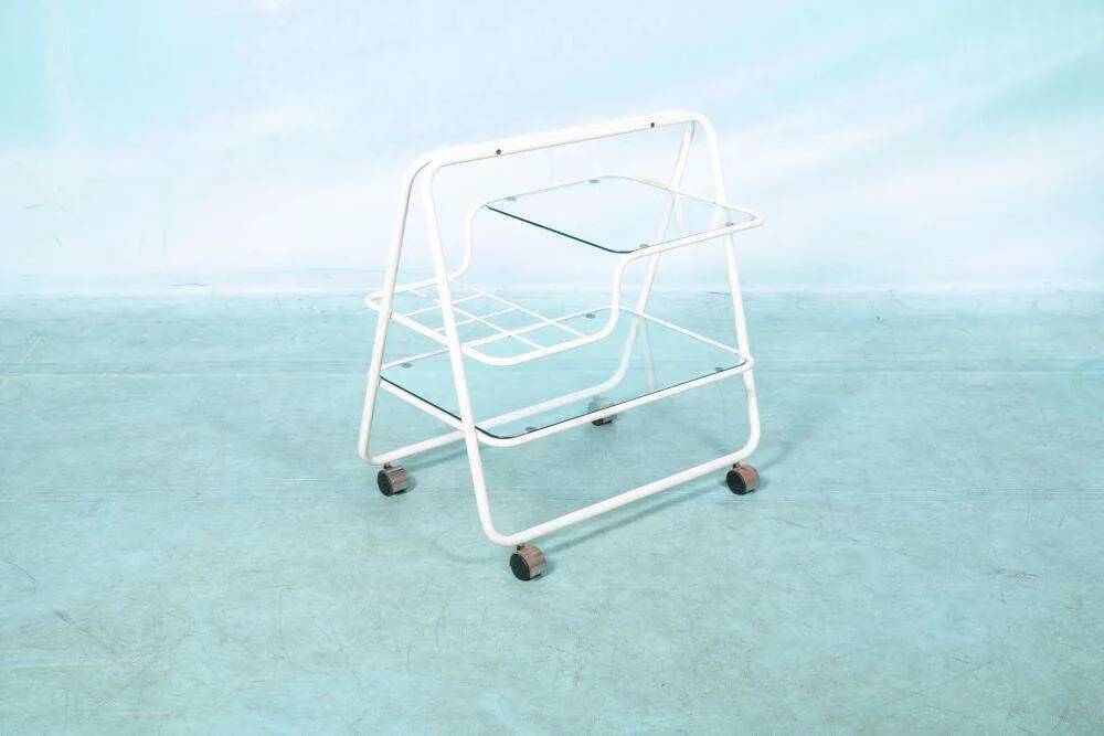Space age dessert trolley from the 1970s, with metal tubes and glass trays.