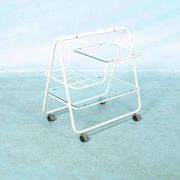 Space age dessert trolley from the 1970s, with metal tubes and glass trays.