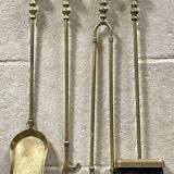 Brass fireplace accessory set with vintage stand