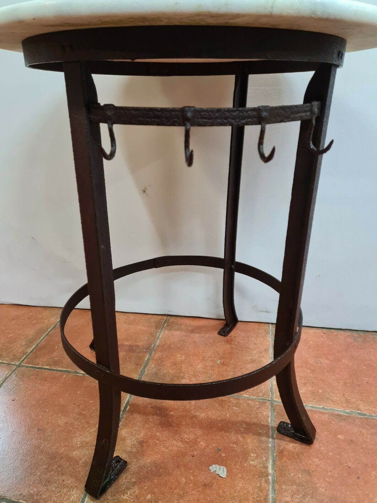 Iron pedestal table and marble top