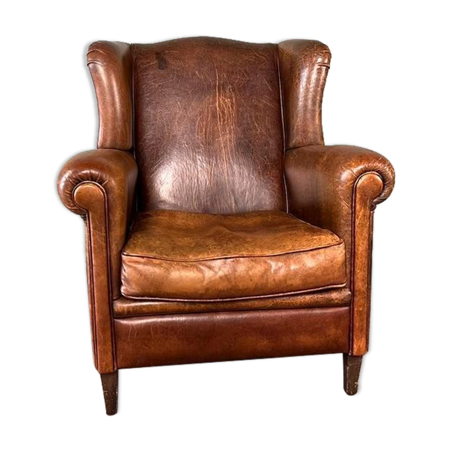Vintage armchair in patinated sheep leather