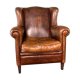 Fauteuil vintage en cuir de mouton patiné