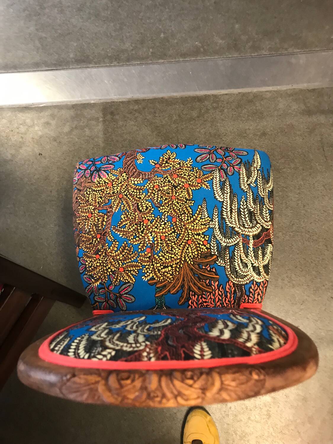 Art Nouveau chair with floral fabric and carved wood