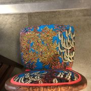 Art Nouveau chair with floral fabric and carved wood