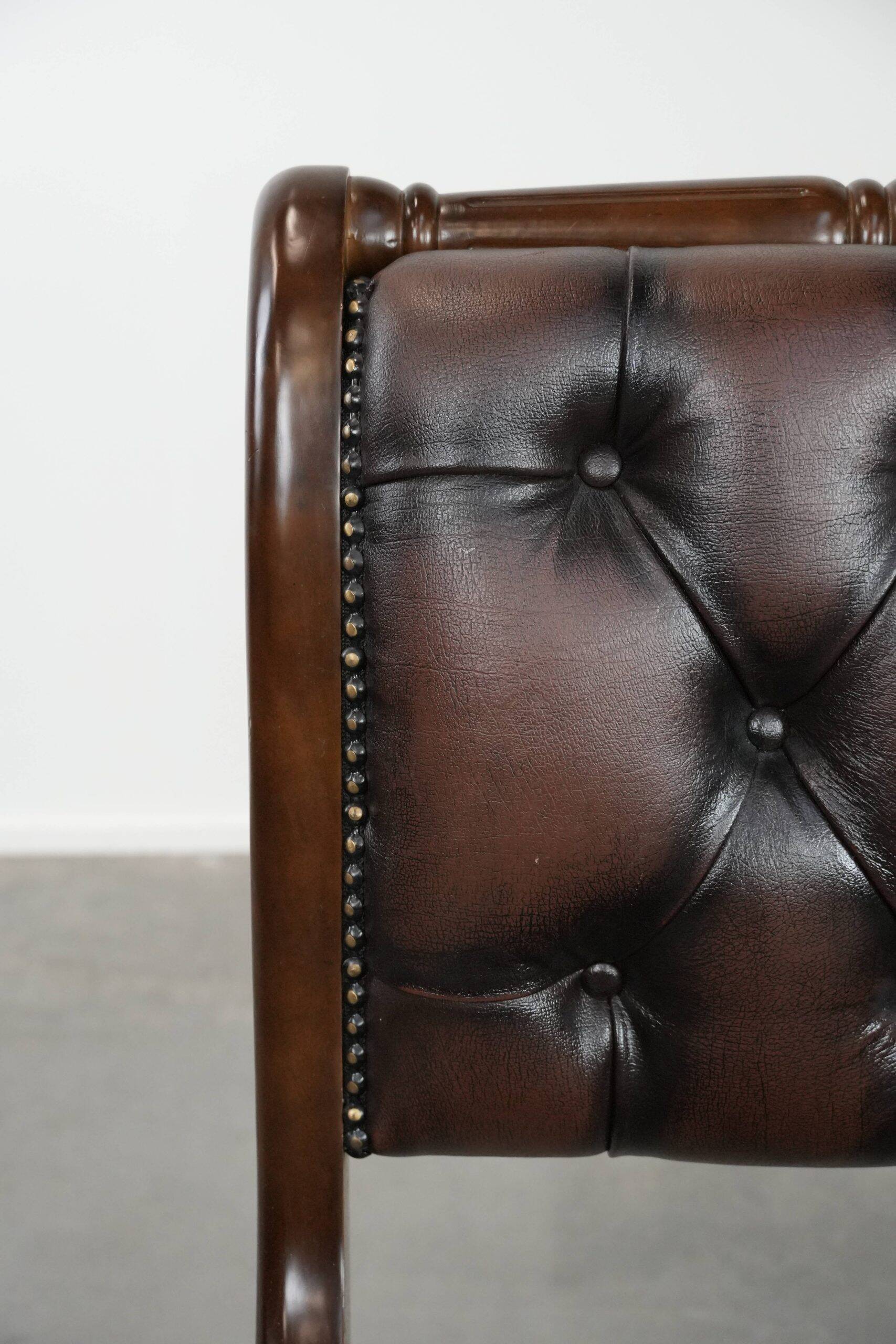 Chesterfield office chair in English style made of cow leather and wood.