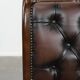 Chesterfield office chair in English style made of cow leather and wood.