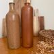 Lot de deux bouteilles en grès émaillé M.K.M vintage brun ocre