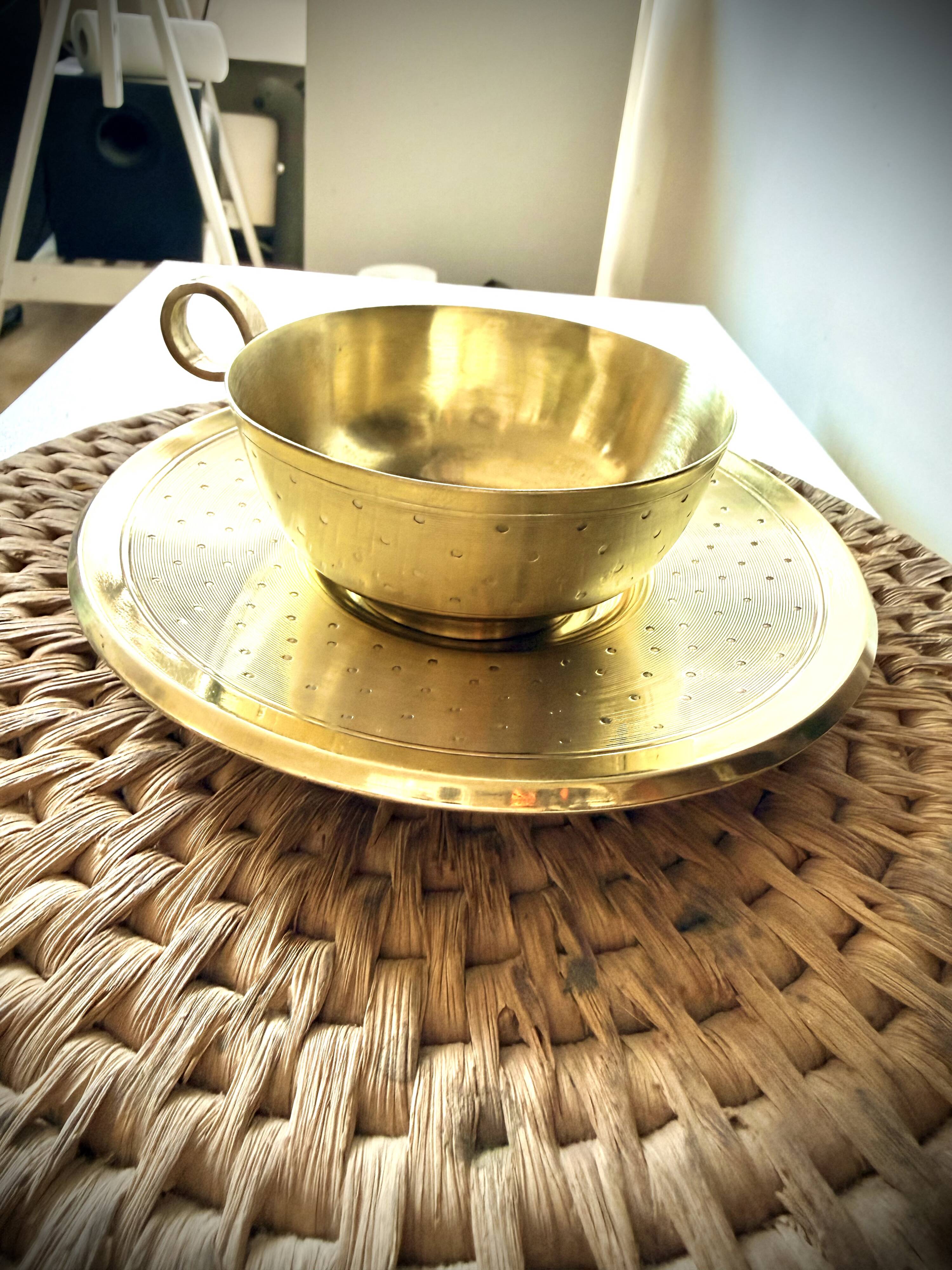 Cup and saucer in brass Saint Médard (18th century)
