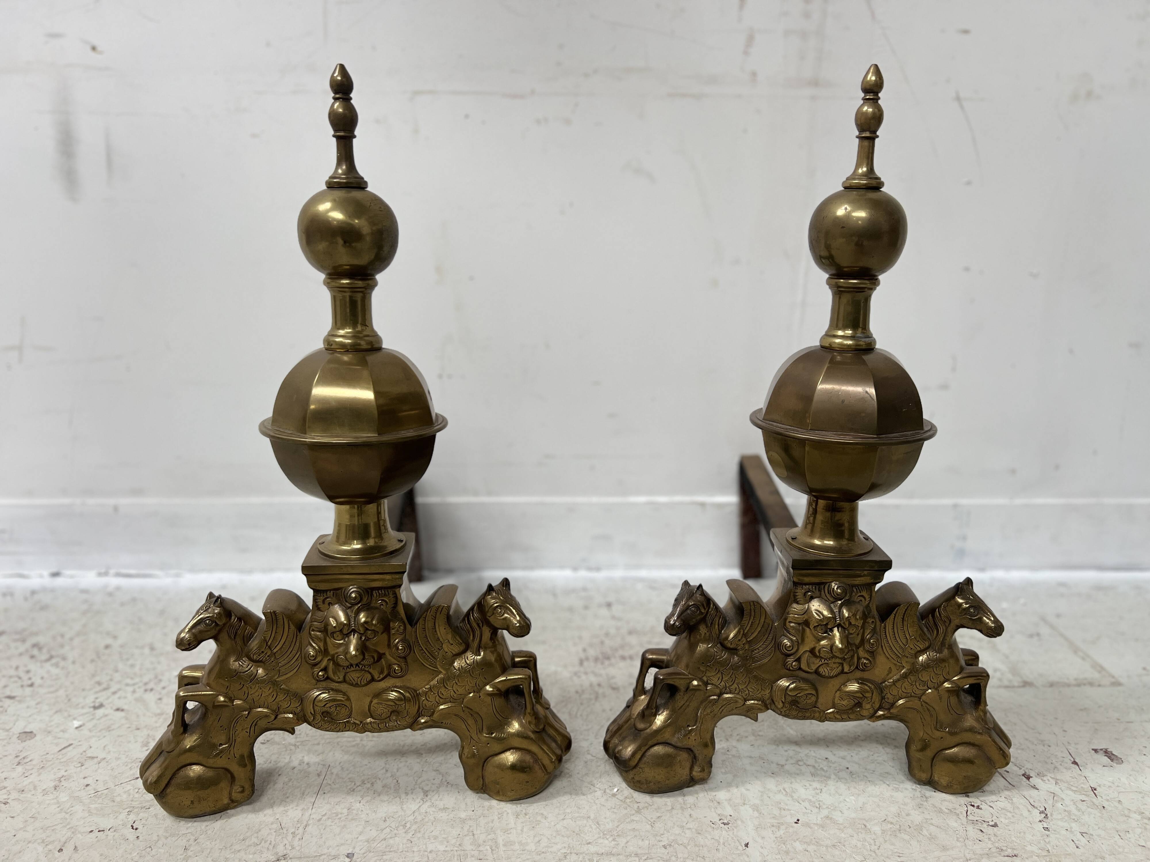 Important pair of brass log holders from the 20th century.