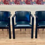 Set of 3 designer leather and metal armchairs.