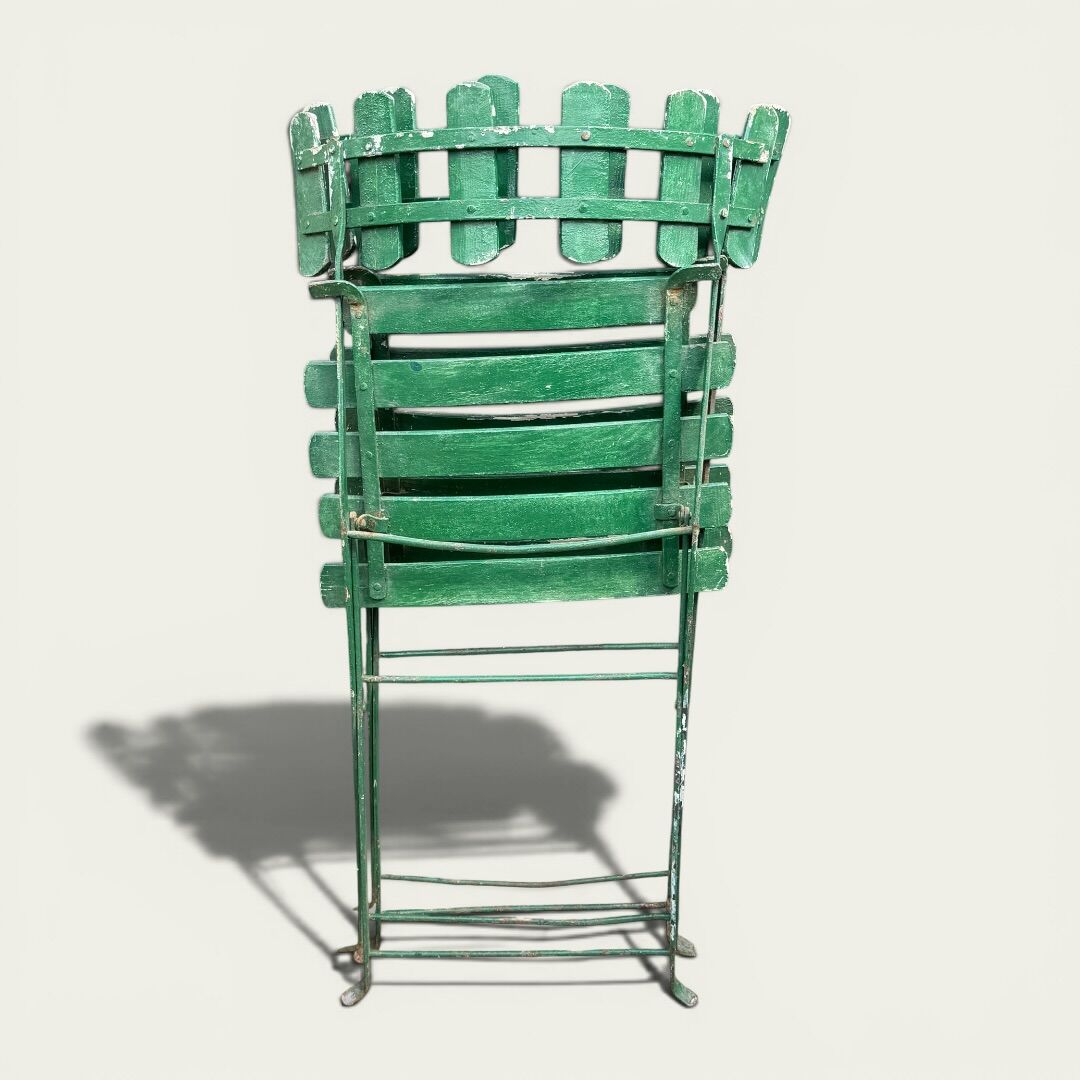 Pair of original patinated folding Parisian bistro chairs.
