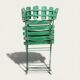 Pair of original patinated folding Parisian bistro chairs.
