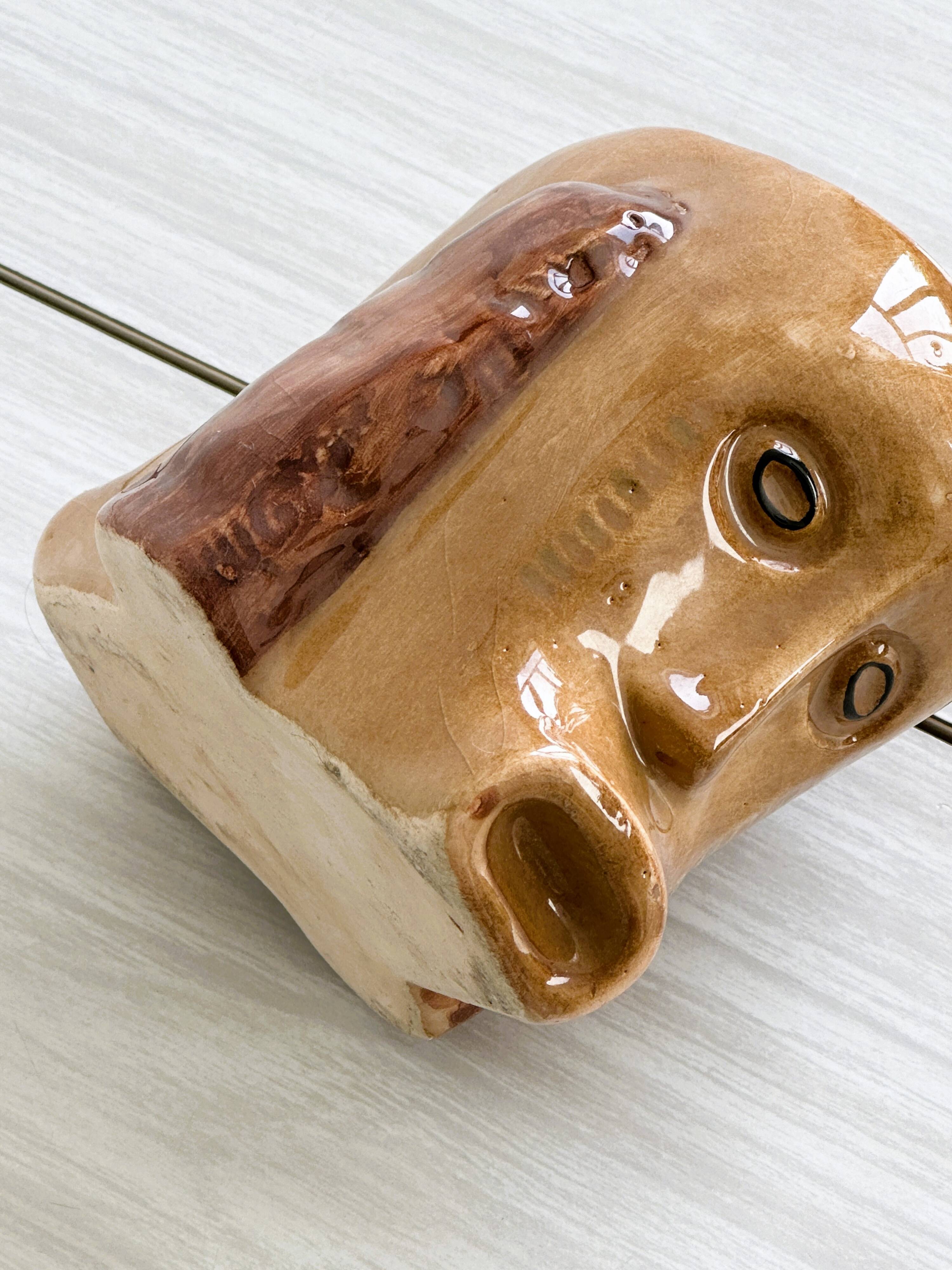 Faces ceramic mug.