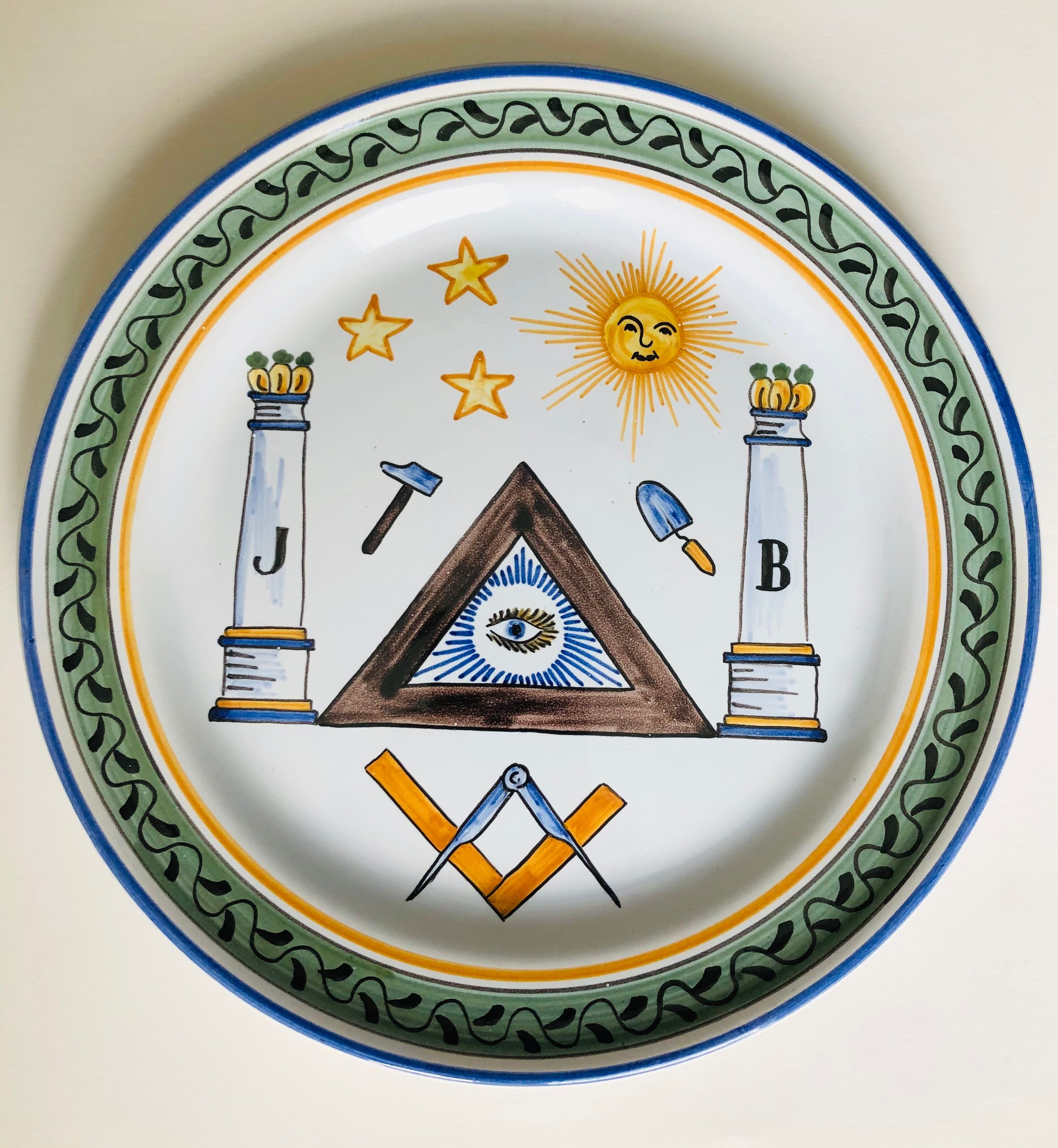 Old collection plate on The Masonic theme