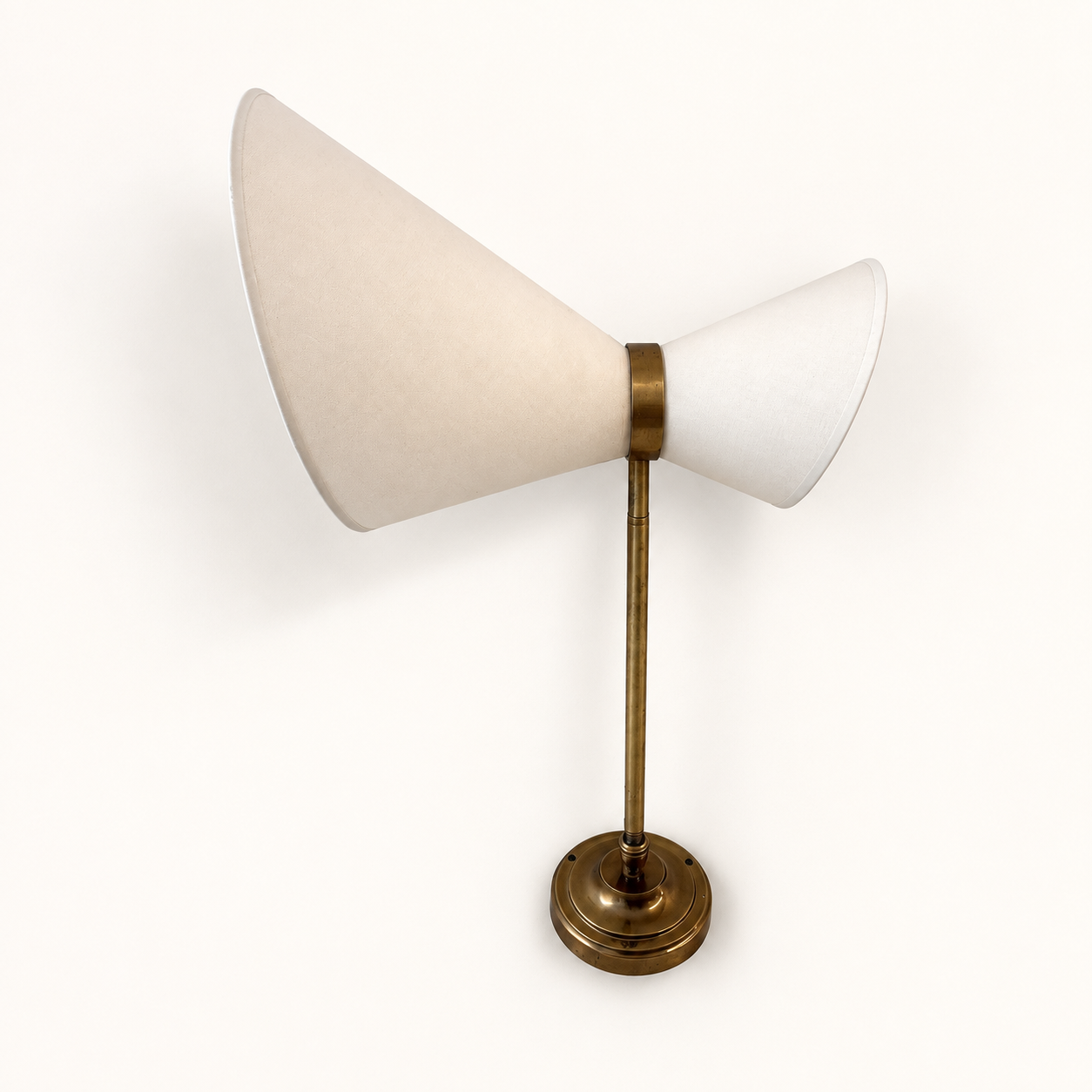 Extendable wall light in the style of Maison Lunel.