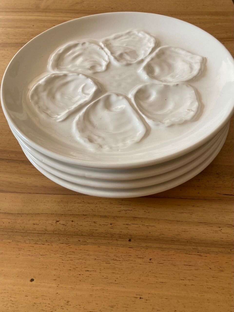 Set of four earthenware oyster plates