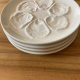 Set of four earthenware oyster plates
