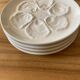 Set of four earthenware oyster plates