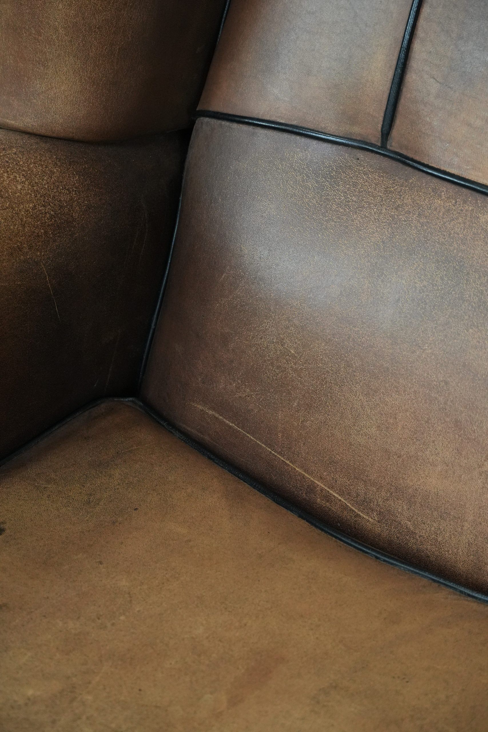 Sheepskin wingback armchair with beautiful colours in good condition