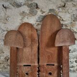 Pair of hand-carved wooden folding chairs – African origin, animal and face motifs, mid-20th century
