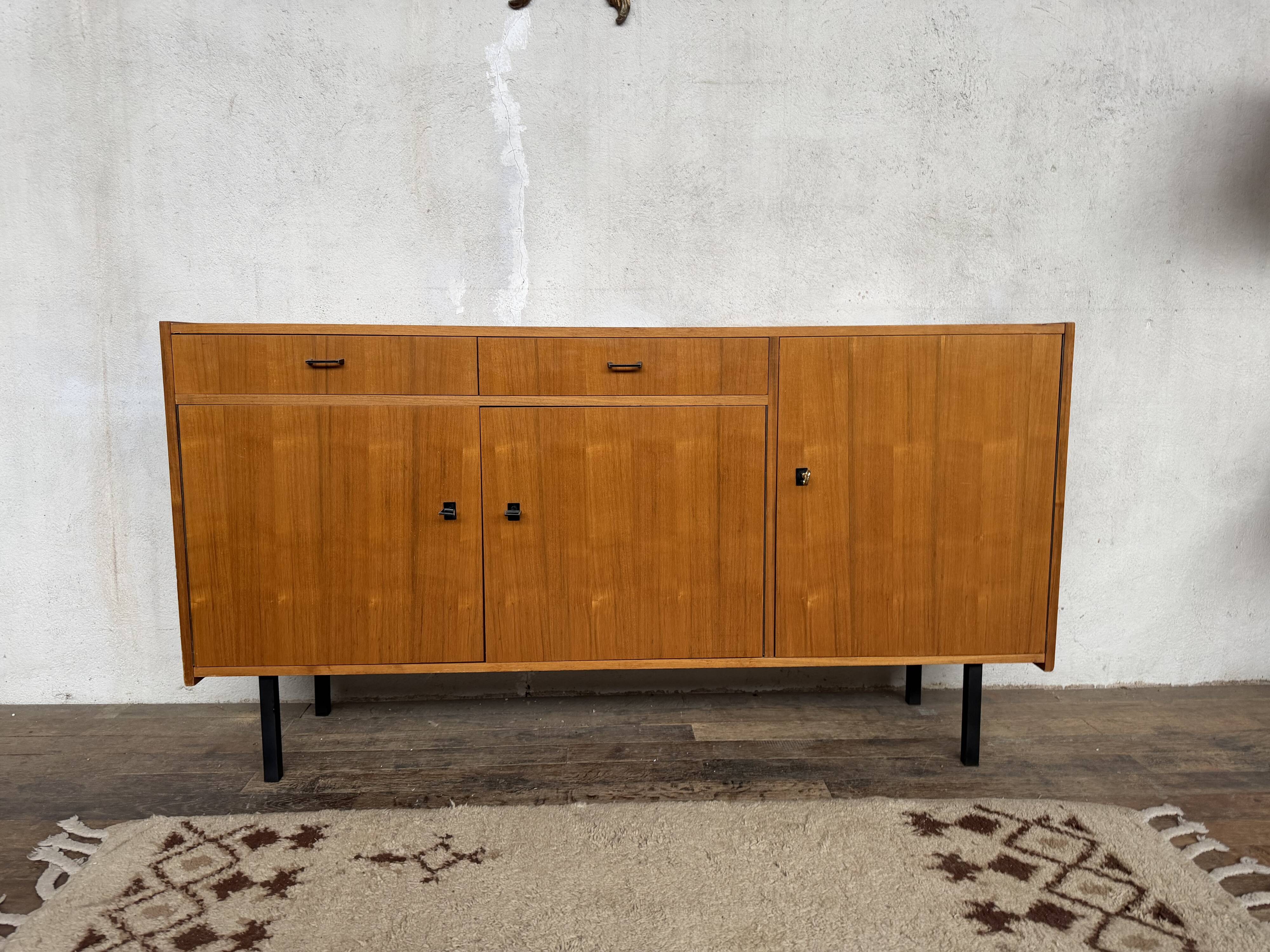 Vintage Scandinavian enfilade with metal legs.