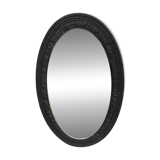 Old oval mirror with slate-coloured patina