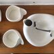 Teapot and cups in contemporary ceramic